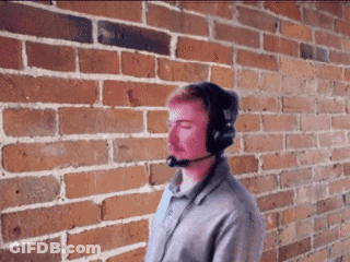 Man With Headphones And Microphone By Brick Wall GIF