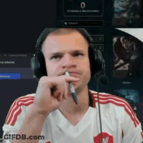 Man With Headphones And Pen At Computer GIF