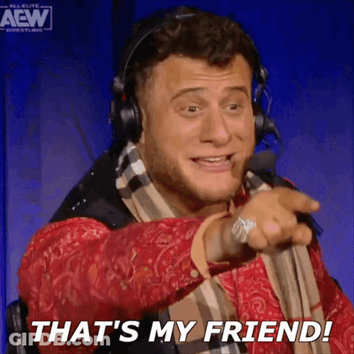 Man With Headphones And Scarf Pointing That's My Friend GIF