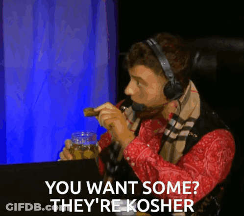 Man With Headphones And Scarf Says You Want Some They're Kosher While Eating GIF