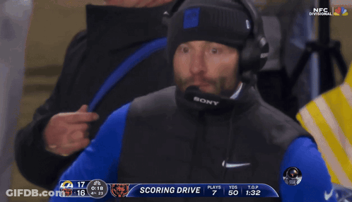 Man With Headphones And Sony Microphone Watching Football GIF