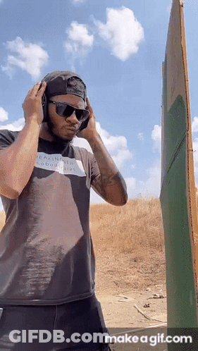 Man With Headphones And Sunglasses In Field GIF