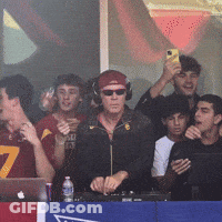Man With Headphones And Sunglasses In Front Of Crowd GIF