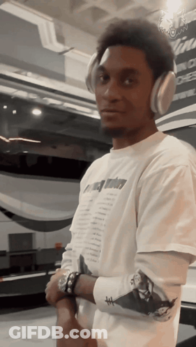 Man With Headphones And T-Shirt Saying A Few Dollars GIF