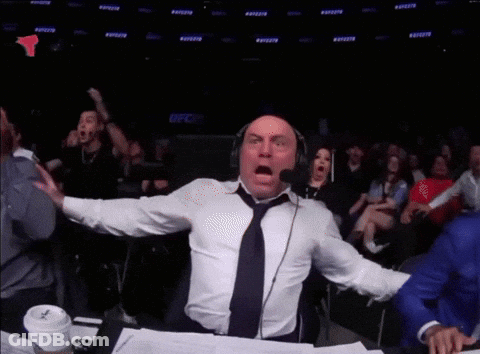 Man With Headphones And Tie In Front Of Crowd GIF
