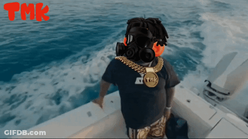 Man With Headphones And TMK Necklace On Boat GIF