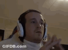 Man With Headphones And White Turtleneck Listening To Music GIF