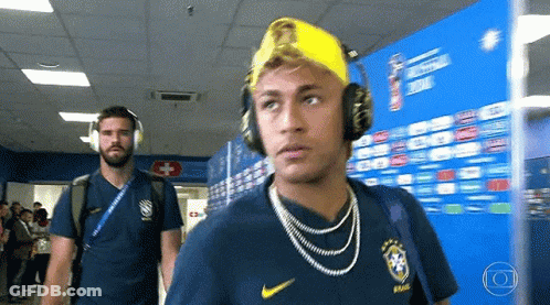 Man With Headphones And Yellow Hat Walking GIF