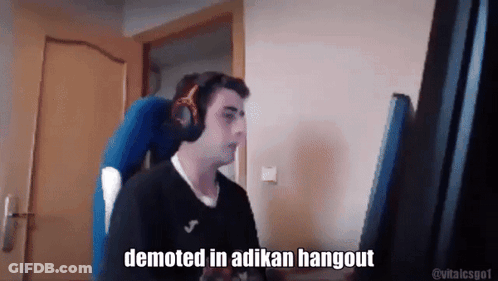 Man With Headphones At Computer Saying Demoted In Adukan Hangout GIF