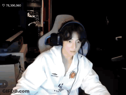 Man With Headphones At Computer Showing 78300,060 GIF