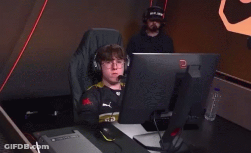 Man With Headphones At Computer With Letter E GIF