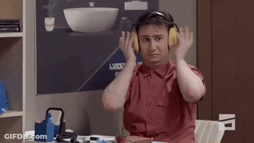 Man With Headphones At Desk GIF