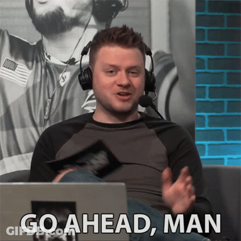 Man With Headphones At Laptop Saying Go Ahead Man GIF