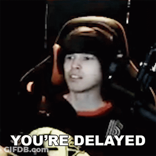 Man With Headphones At Microphone Says You're Delayed GIF