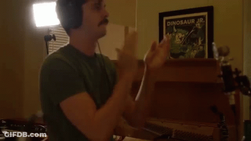 Man With Headphones Clapping In Front Of Dinosaur Jr. Picture GIF