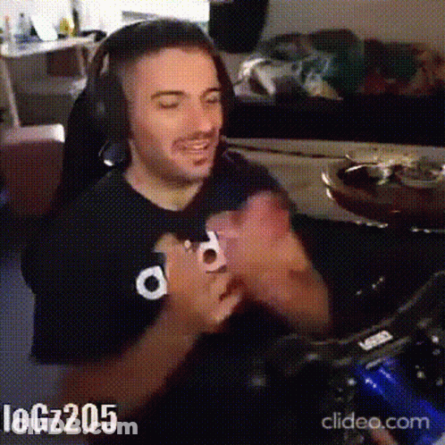 Man With Headphones Clapping While Gaming GIF
