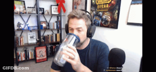 Man With Headphones Drinking From Cup GIF