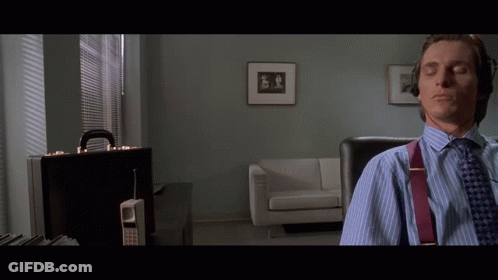 Man With Headphones Eyes Closed In Living Room GIF