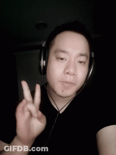 Man With Headphones Giving Peace Sign GIF