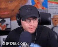 Man With Headphones Hat And Glasses At Microphone GIF