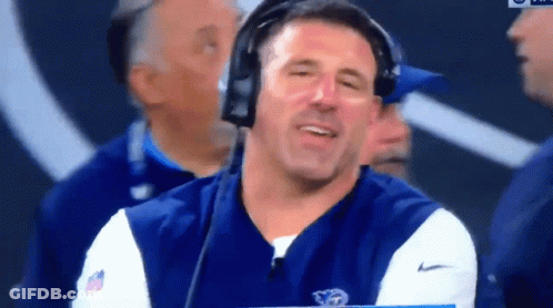 Man With Headphones Holding Clipboard In Front Of NFL Logo GIF