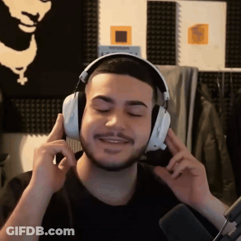 Man With Headphones Holding Comb GIF