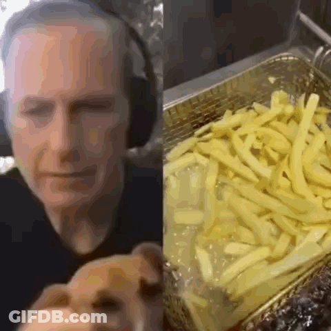 Man With Headphones Holding Dog GIF