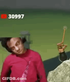 Man With Headphones Holding Hammer Making Funny Face GIF