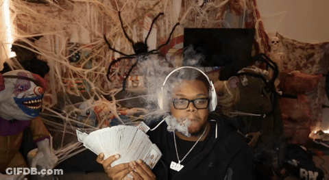 Man With Headphones Holding Money GIF