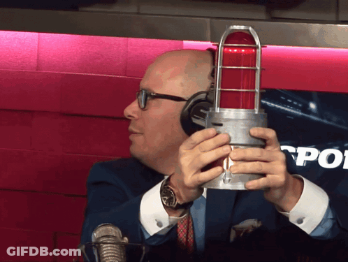 Man With Headphones Holding Red Light GIF