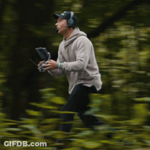 Man With Headphones Holding Remote Control GIF