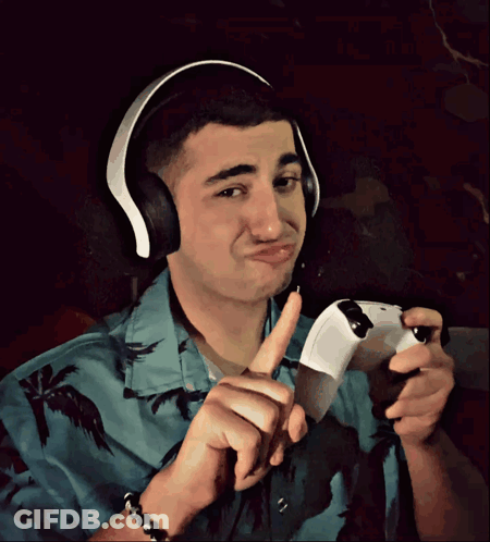 Man With Headphones Holding Video Game Controller GIF