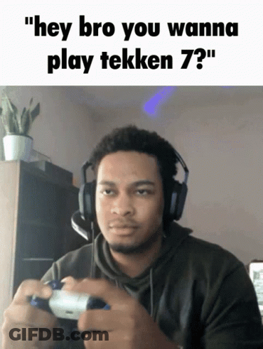 Man With Headphones Holding Video Game Controller GIF