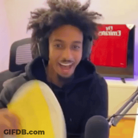 Man With Headphones Holding Yellow Frisbee At Microphone GIF
