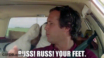 Man With Headphones In Car Saying Russ Russ Your Feet GIF