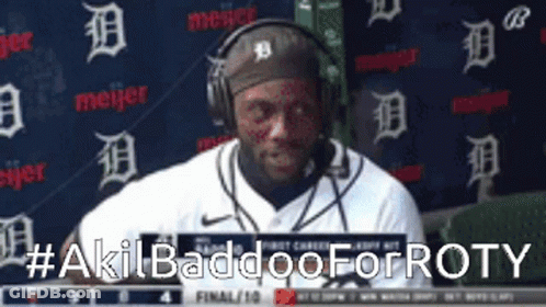 Man With Headphones In Front Of Meijer Wall GIF