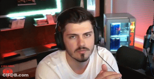 Man With Headphones In Front Of Red Bull Refrigerator GIF
