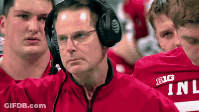 Man With Headphones In Front Of Red Shirt Players Saying Big GIF