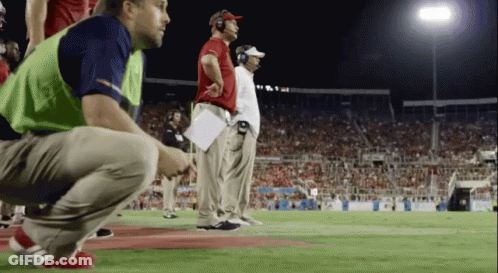 Man With Headphones In Front Of Viasat Sport Sign GIF