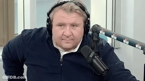 Man With Headphones In Front Of WFAN Microphone GIF