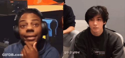 Man With Headphones Next To Man In Black Shirt Saying Tommy GIF