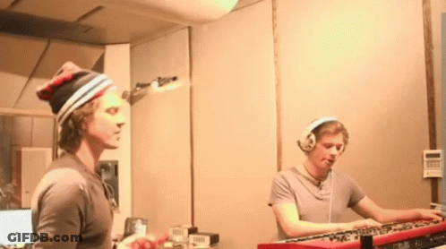 Man With Headphones Playing Keyboard GIF
