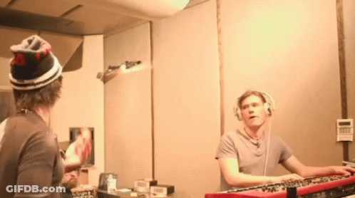 Man With Headphones Playing Keyboard At Mirror GIF