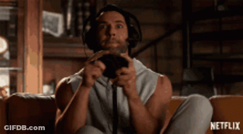 Man With Headphones Playing Video Game On Couch GIF