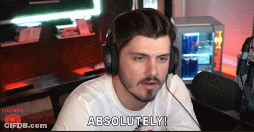 Man With Headphones Saying Absolutely In Front Of Red Bull Cooler GIF