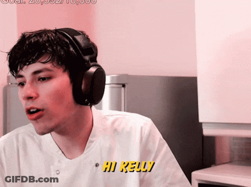 Man With Headphones Saying Hi Kelly In Yellow GIF