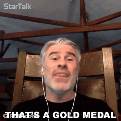 Man With Headphones Saying That's A Gold Medal GIF