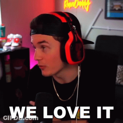 Man With Headphones Saying We Love It Into Microphone GIF