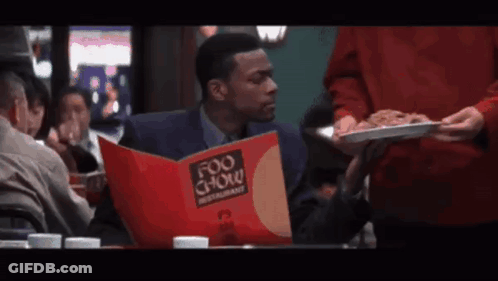Man With Headphones Says Completely Worthless In Front Of Brick Wall GIF