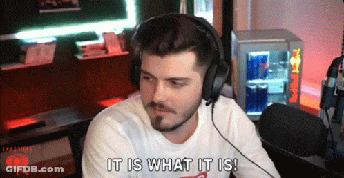 Man With Headphones Says It Is What It Is In Front Of Red Bull Cooler GIF